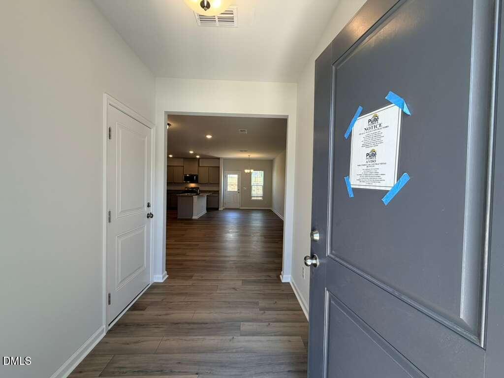 5024 Reader Way Durham, NC 27703 - Photo 2 of 26 a view of a hallway with wooden floor