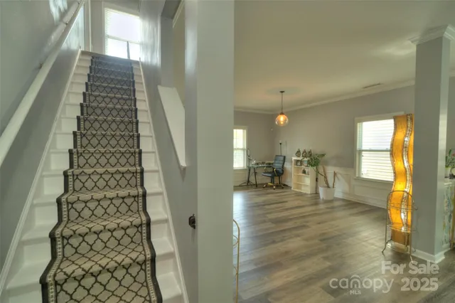 a view of livingroom with furniture and a flat screen tv
