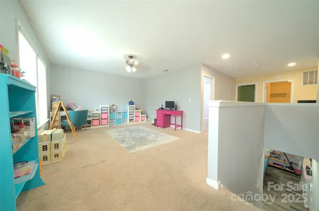 a bedroom with a bed and a mirror