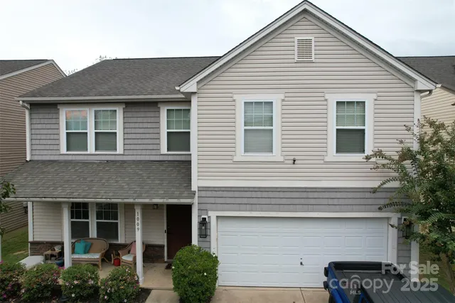 a front view of a house with garage