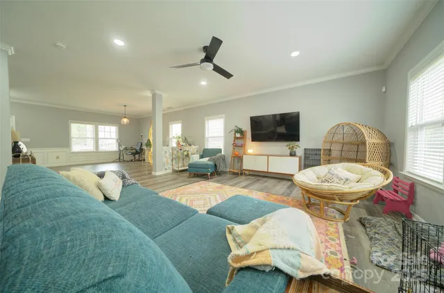 a living room with furniture and a flat screen tv