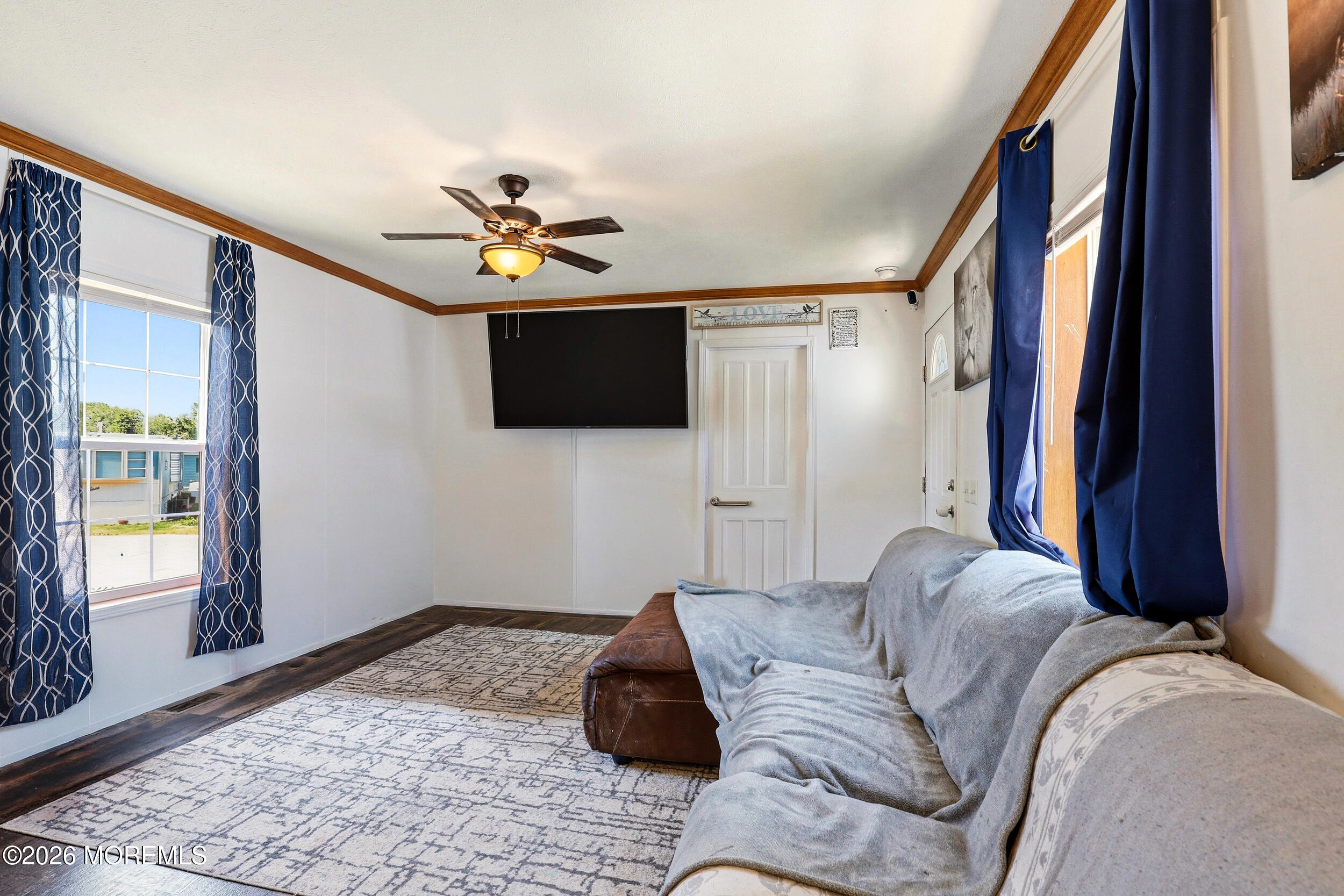 40 Locust Grove Hazlet, NJ 07730 - Photo 5 of 15 a living room with furniture a ceiling fan and a window