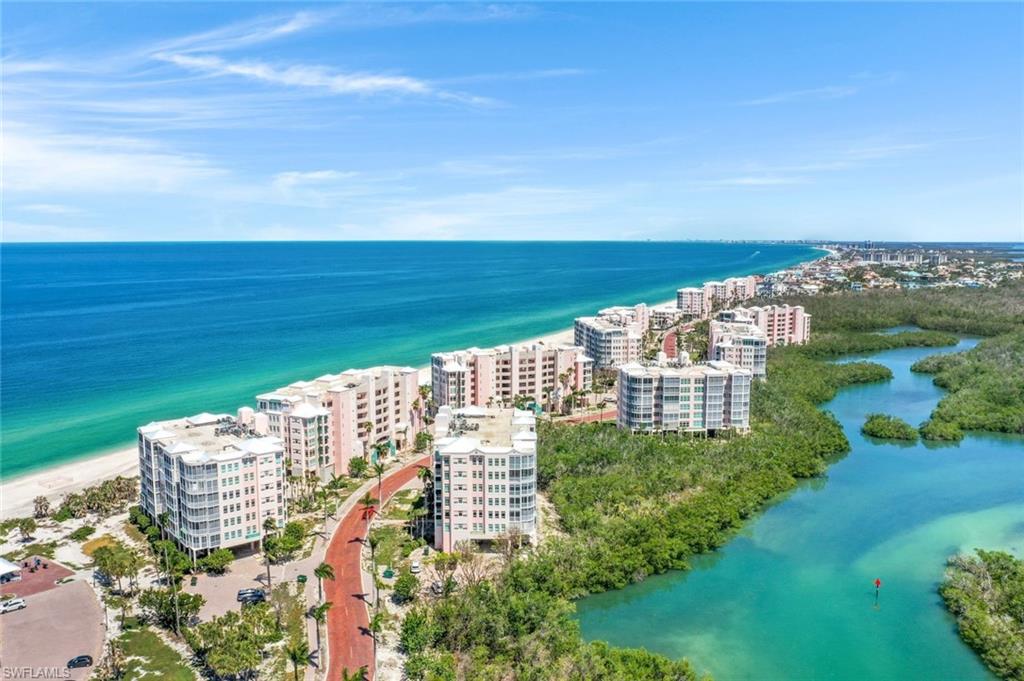 269 Barefoot Beach Boulevard, Unit 403 Bonita Springs, FL 34134 - Photo 26 of 27 View of urban area with a nearby body of water and apartment complex / building