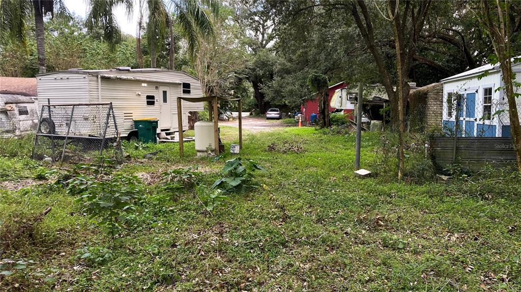 770 Snow Hill Road Geneva, FL 32732 - Photo 6 of 16 a view of house with a yard and potted plants