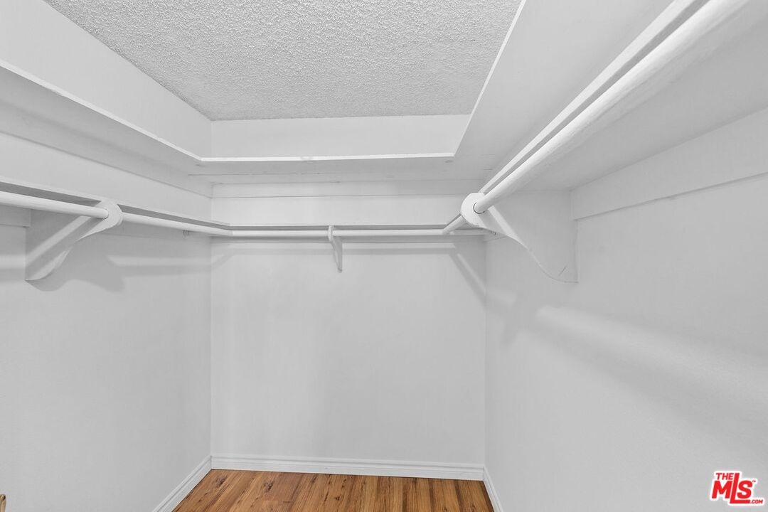 10535 Wilshire Boulevard, Unit 801 Los Angeles, CA 90024 - Photo 28 of 53 a view of walk in closet with empty racks