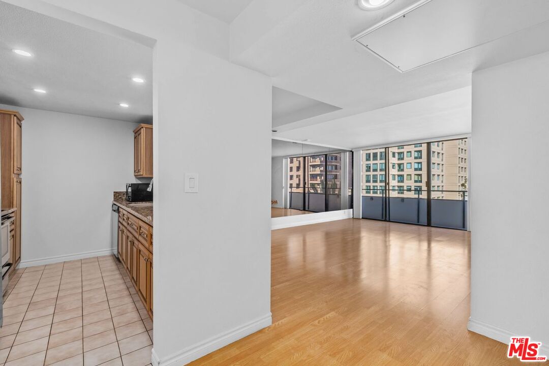 10535 Wilshire Boulevard, Unit 801 Los Angeles, CA 90024 - Photo 3 of 53 a view of an empty room with a window