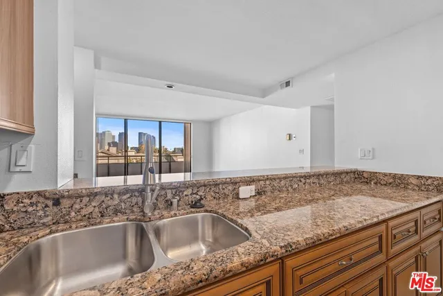 a kitchen with granite countertop a sink and granite top
