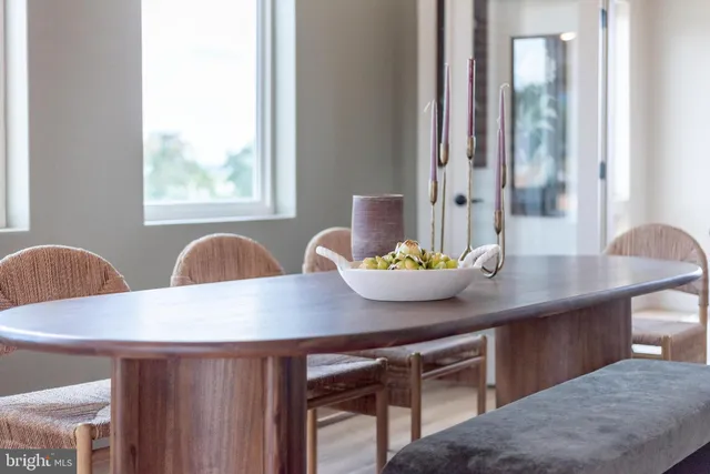 a view of a dining room with furniture and window