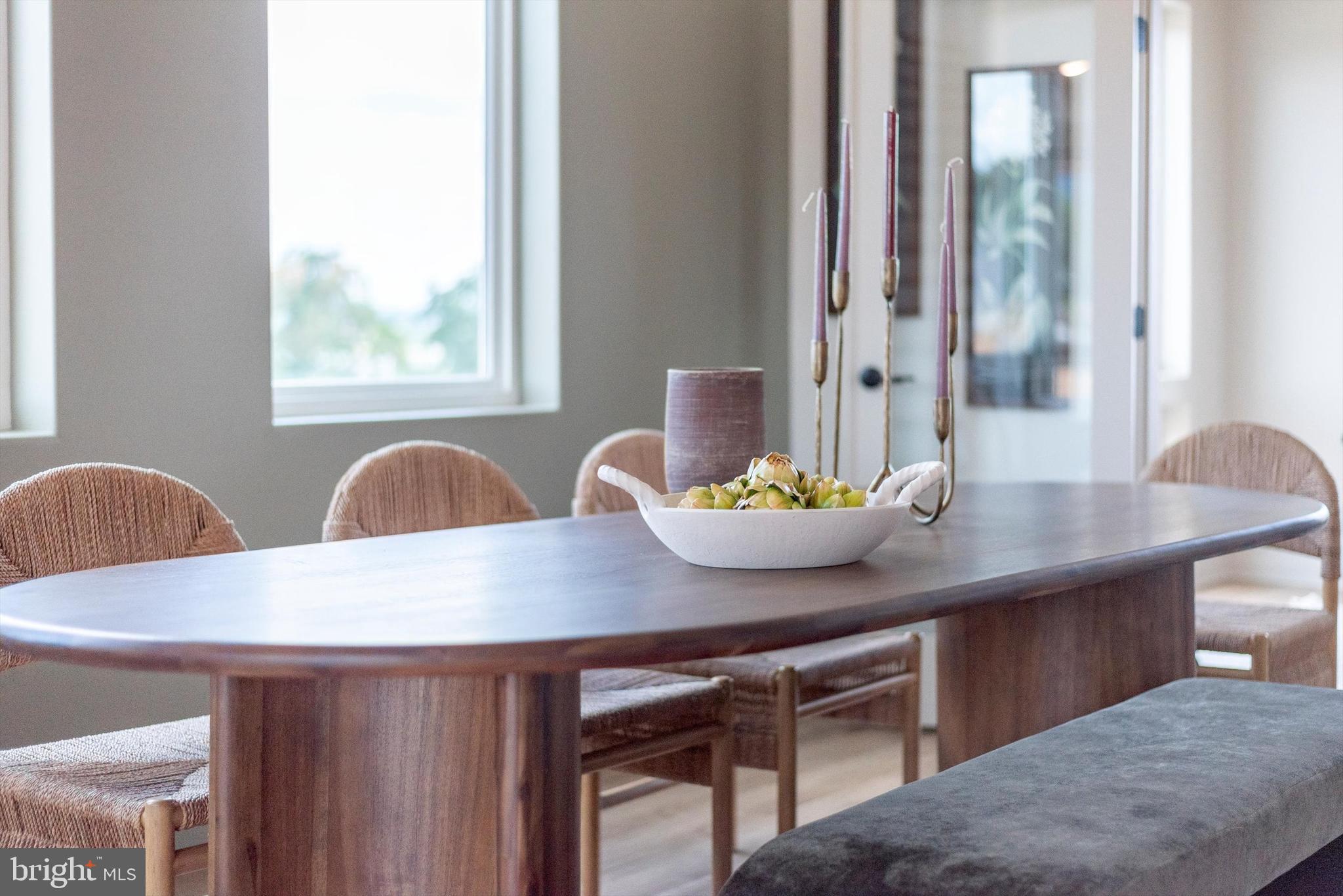 710 D Iron Frg Road Frederick, MD 21702 - Photo 14 of 37 a view of a dining room with furniture and window