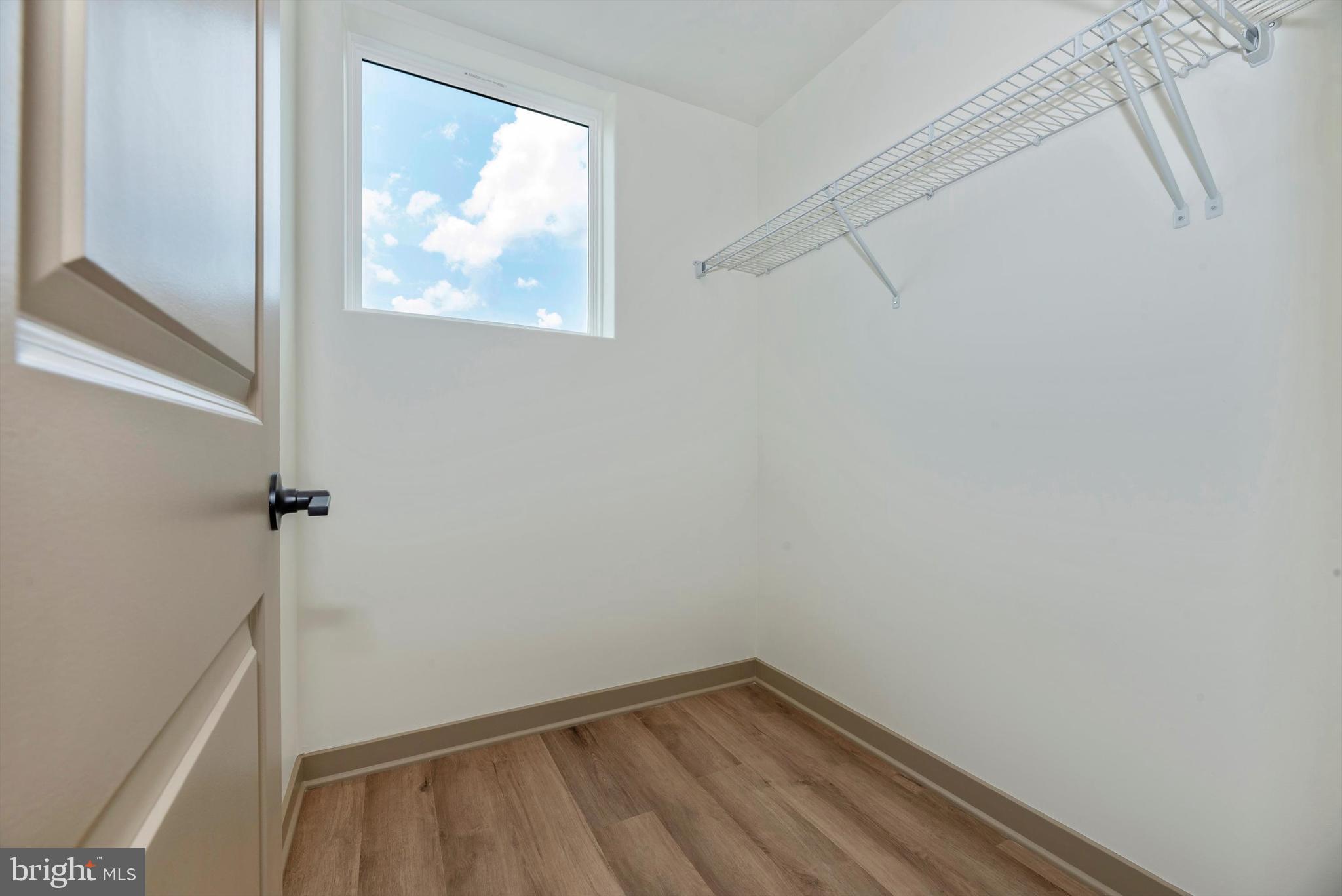710 D Iron Frg Road Frederick, MD 21702 - Photo 31 of 37 a view of a small space with wooden floor and windows