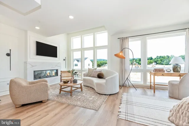 a living room with fireplace furniture and a flat screen tv
