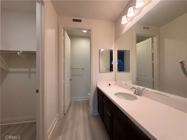 a bathroom with a double vanity sink and mirror