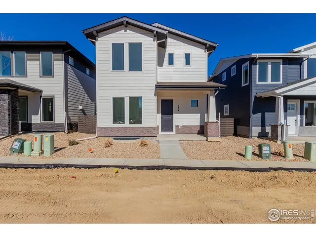 a view of a house with large windows