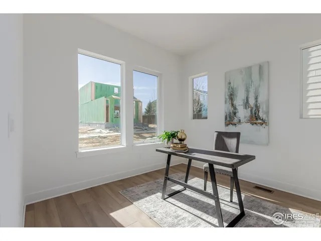 a work room with furniture and a window