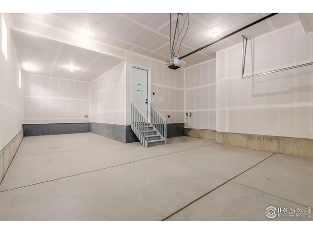 a view of empty room with white walls