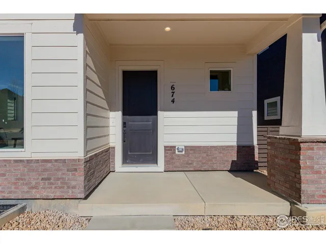 a front view of a house with a garage