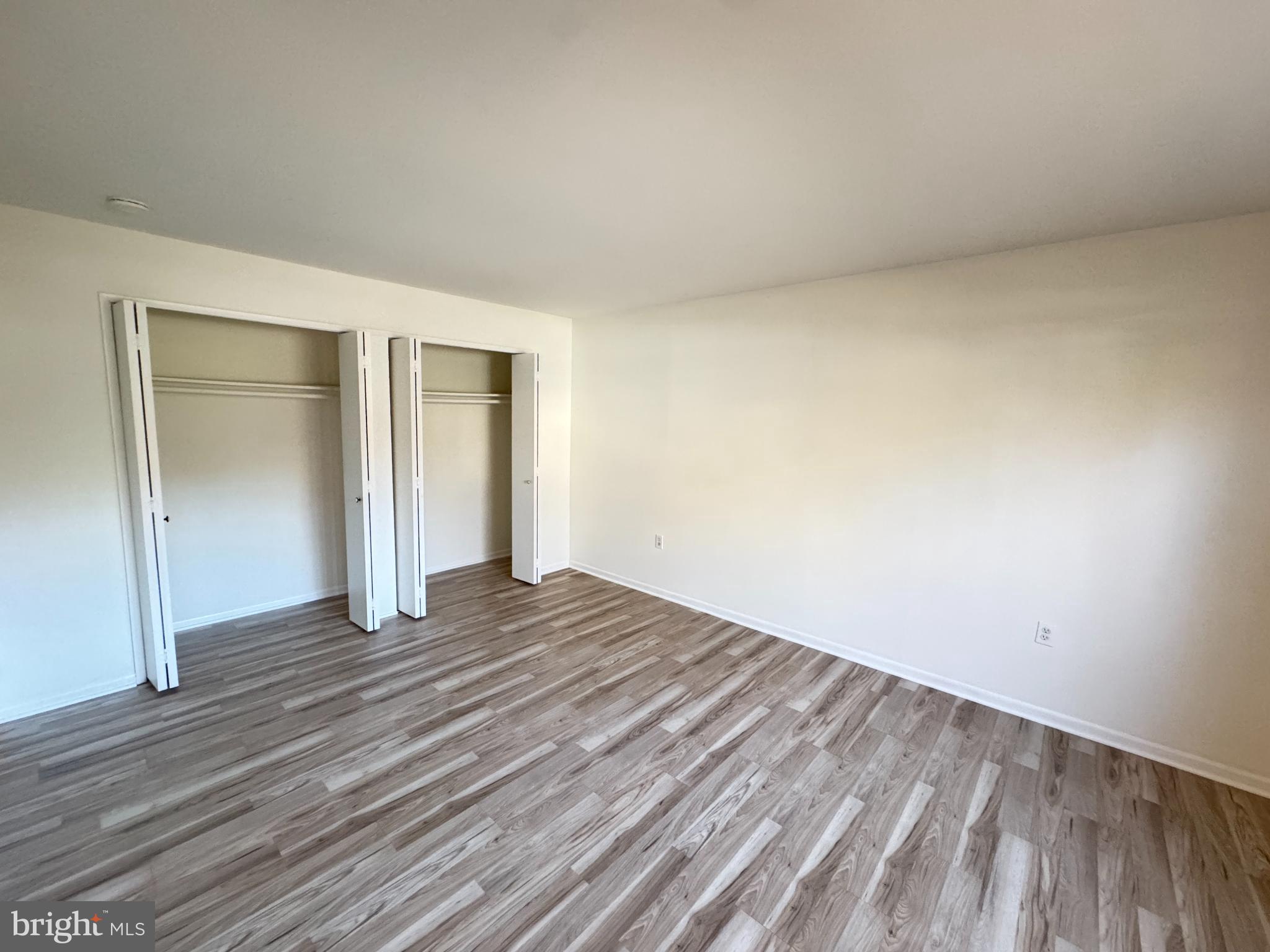 5033 Green Mountain Circle, Unit 2 Columbia, MD 21044 - Photo 17 of 40 a view of an empty room and wooden floor