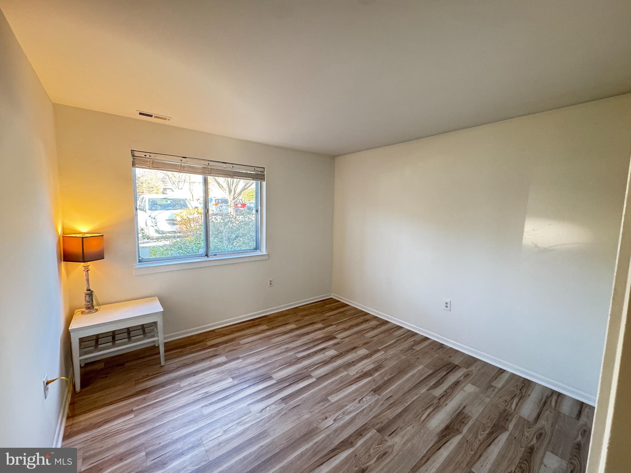 5033 Green Mountain Circle, Unit 2 Columbia, MD 21044 - Photo 21 of 40 a view of wooden floor and windows in a room