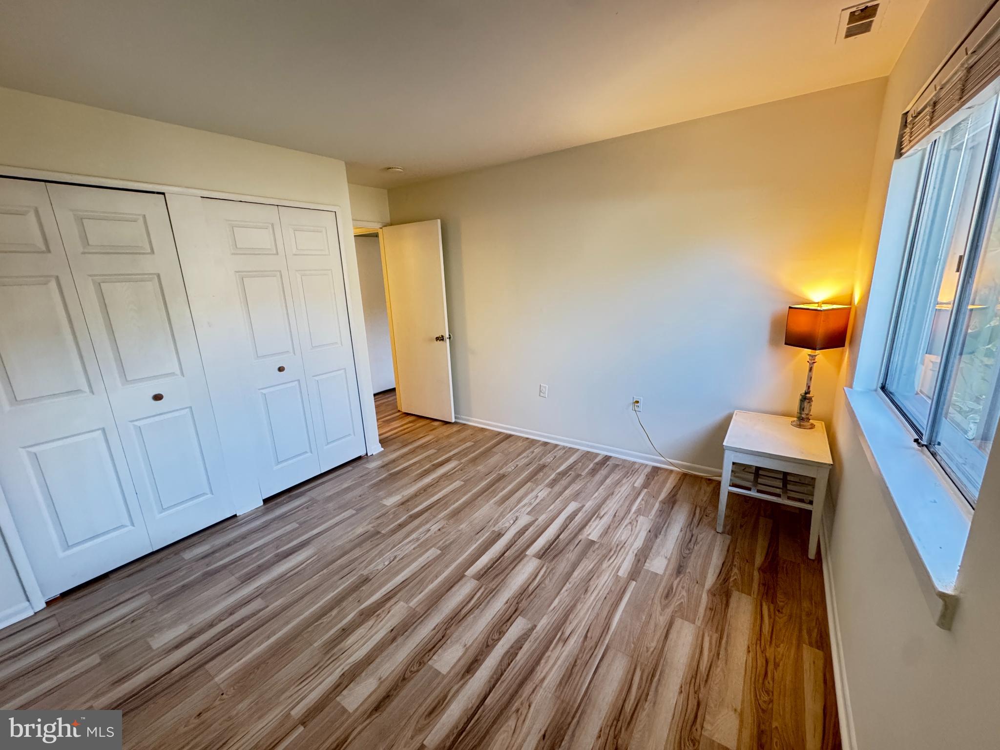 5033 Green Mountain Circle, Unit 2 Columbia, MD 21044 - Photo 23 of 40 a view of a room with wooden floor and furniture