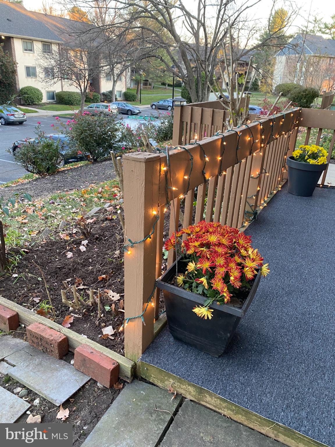 5033 Green Mountain Circle, Unit 2 Columbia, MD 21044 - Photo 30 of 40 Charming porch adorned with festive lights.