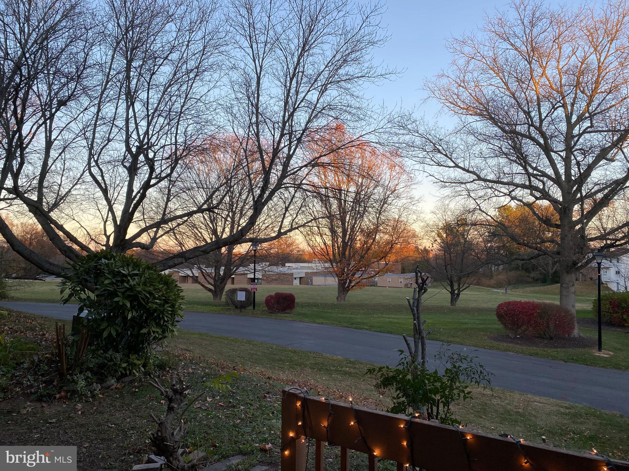 5033 Green Mountain Circle, Unit 2 Columbia, MD 21044 - Photo 33 of 40 Serene twilight over a tranquil landscape.