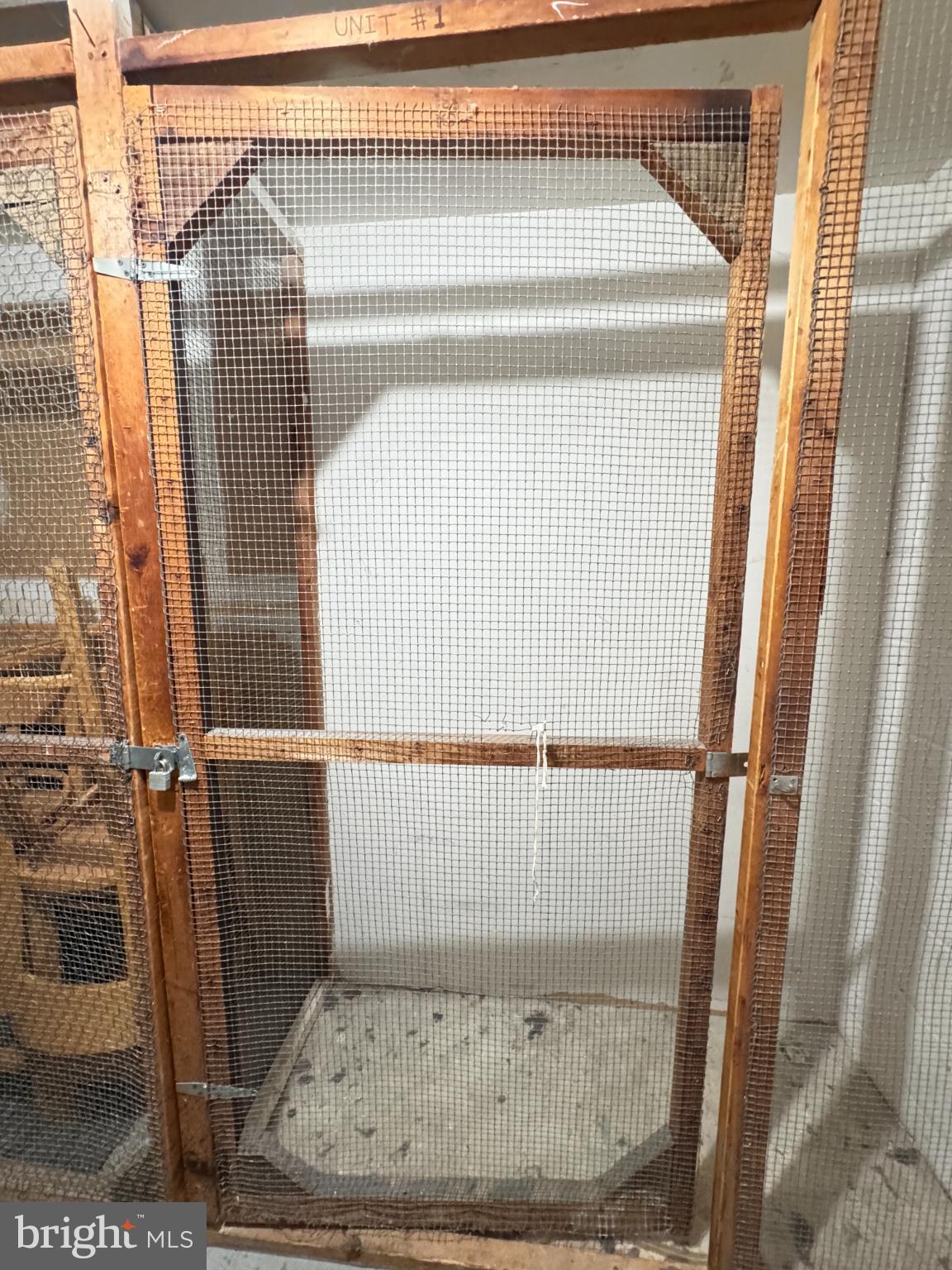 5033 Green Mountain Circle, Unit 2 Columbia, MD 21044 - Photo 39 of 40 Rustic wooden enclosure with mesh detailing.