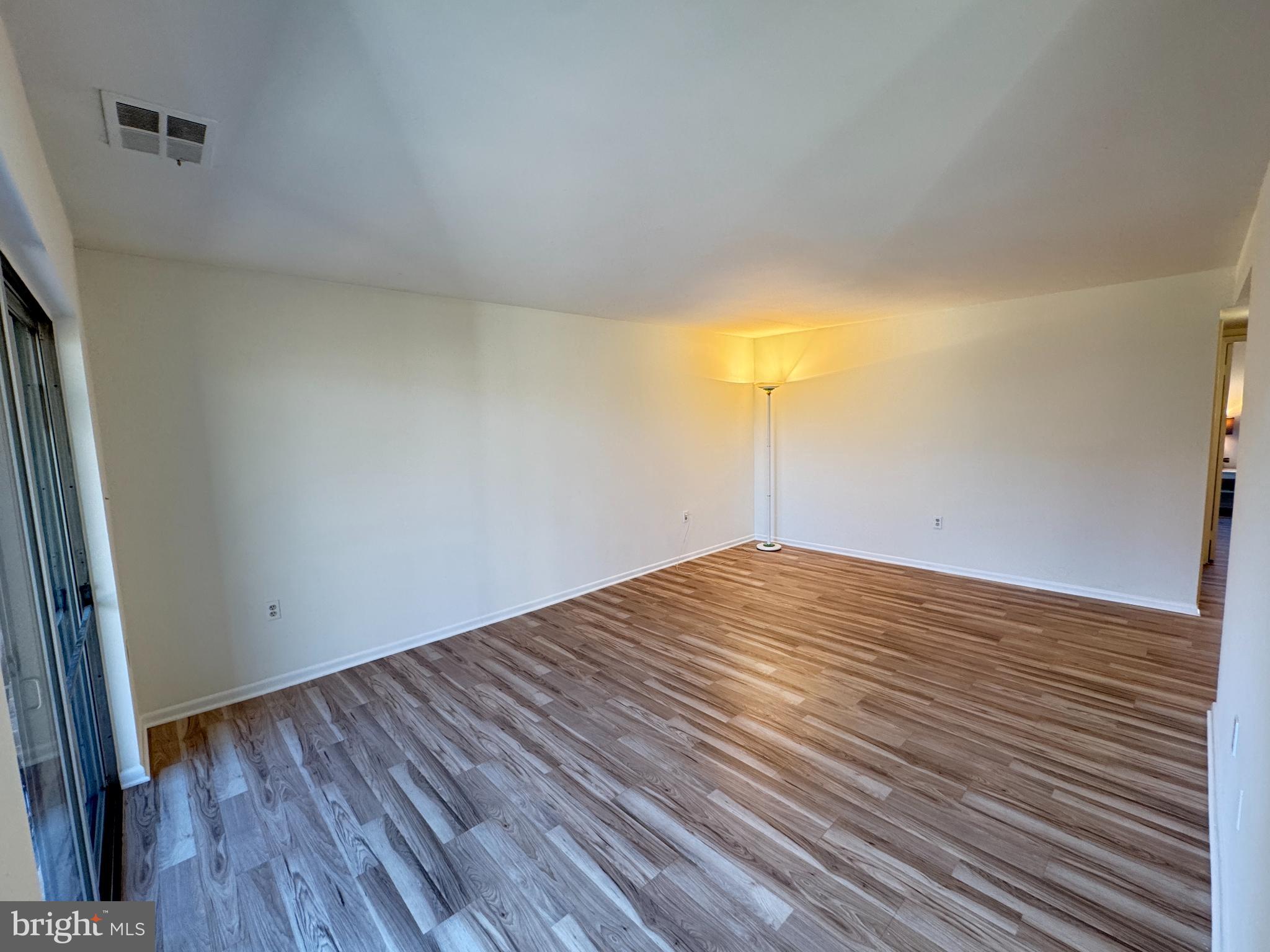 5033 Green Mountain Circle, Unit 2 Columbia, MD 21044 - Photo 4 of 40 Spacious room with warm natural light.