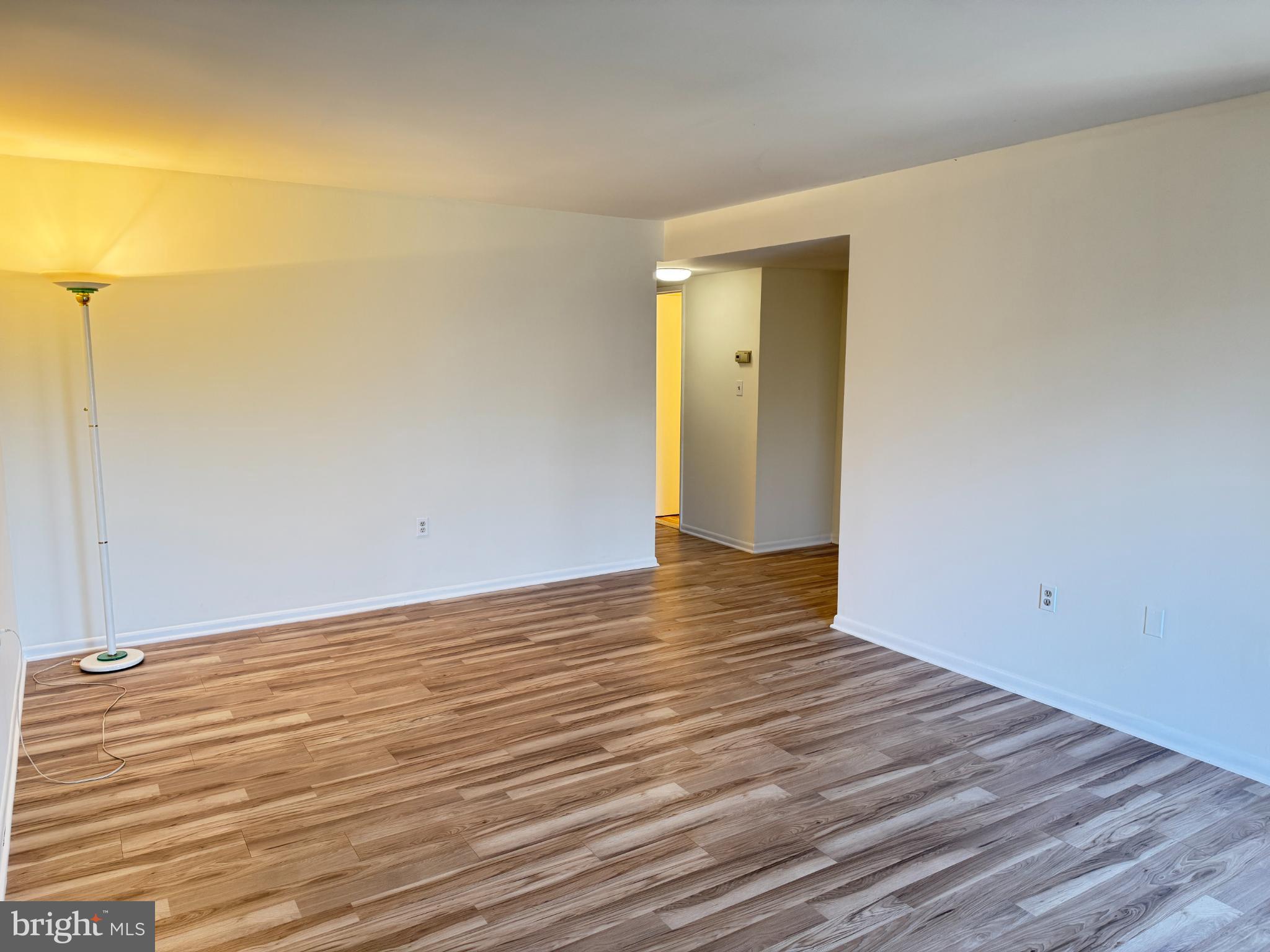 5033 Green Mountain Circle, Unit 2 Columbia, MD 21044 - Photo 5 of 40 Spacious, sunlit living area awaits your touch.