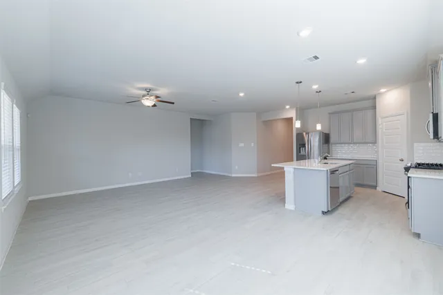 a view of kitchen and kitchen with a sink