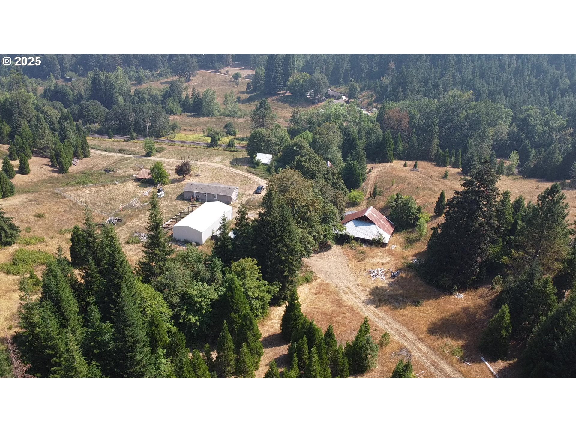 911 Tunnel Road Glendale, OR 97442 - Photo 26 of 29 a bathroom with a sink and mirror