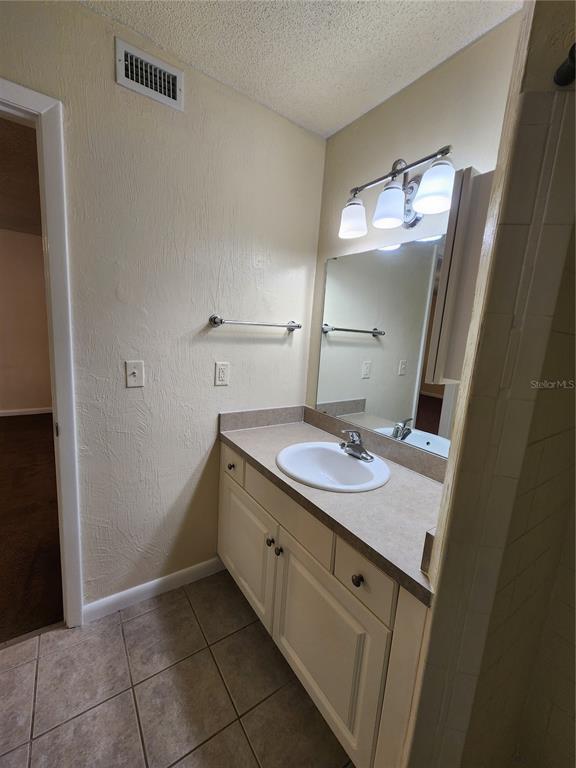 501 Southwest 75th Street, Unit A14 Gainesville, FL 32607 - Photo 40 of 56 a bathroom with a sink and a mirror
