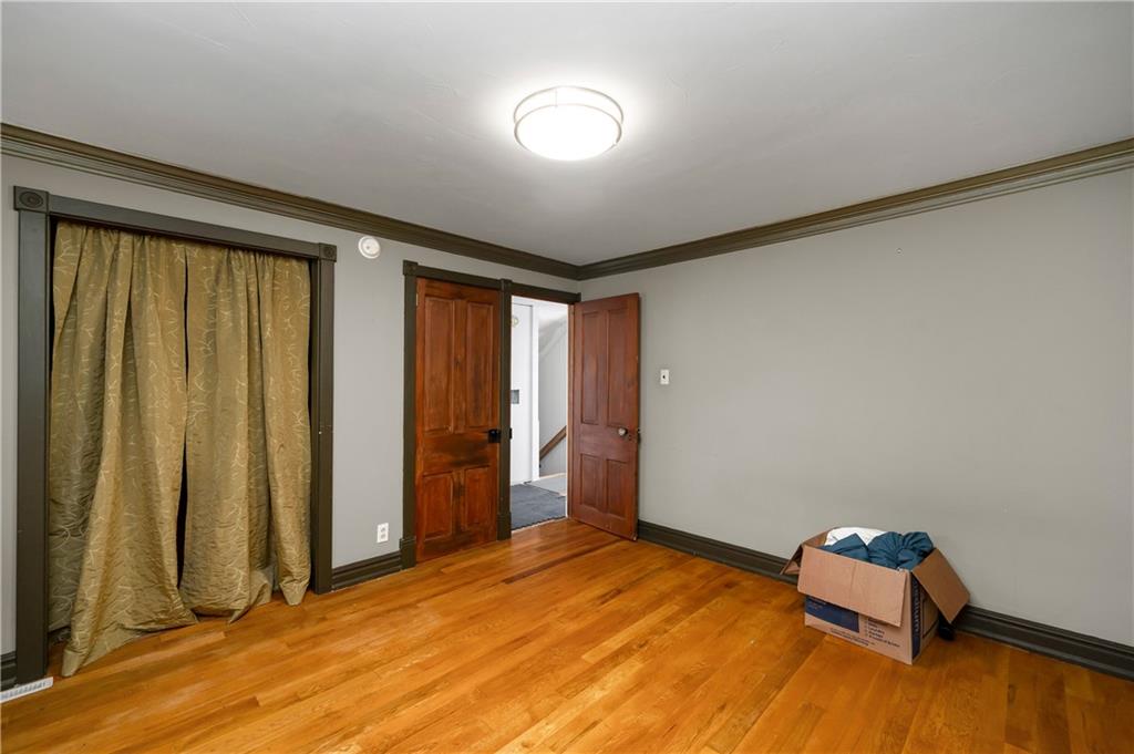 438 Main Street Prospect, PA 16052 - Photo 27 of 46 an empty room with closet and wooden floor