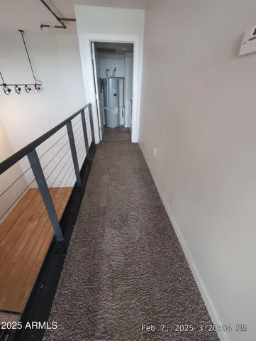 a bathroom with a granite countertop sink a mirror and a shower
