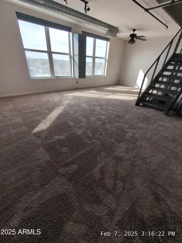 a view of a hallway with stairs