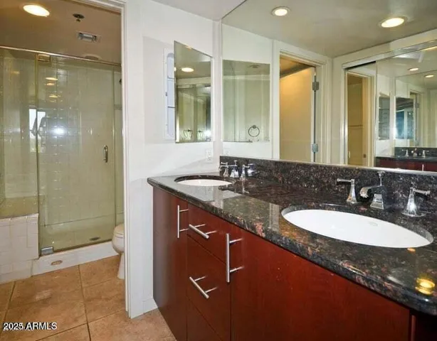 a view of staircase with wooden floor and white walls