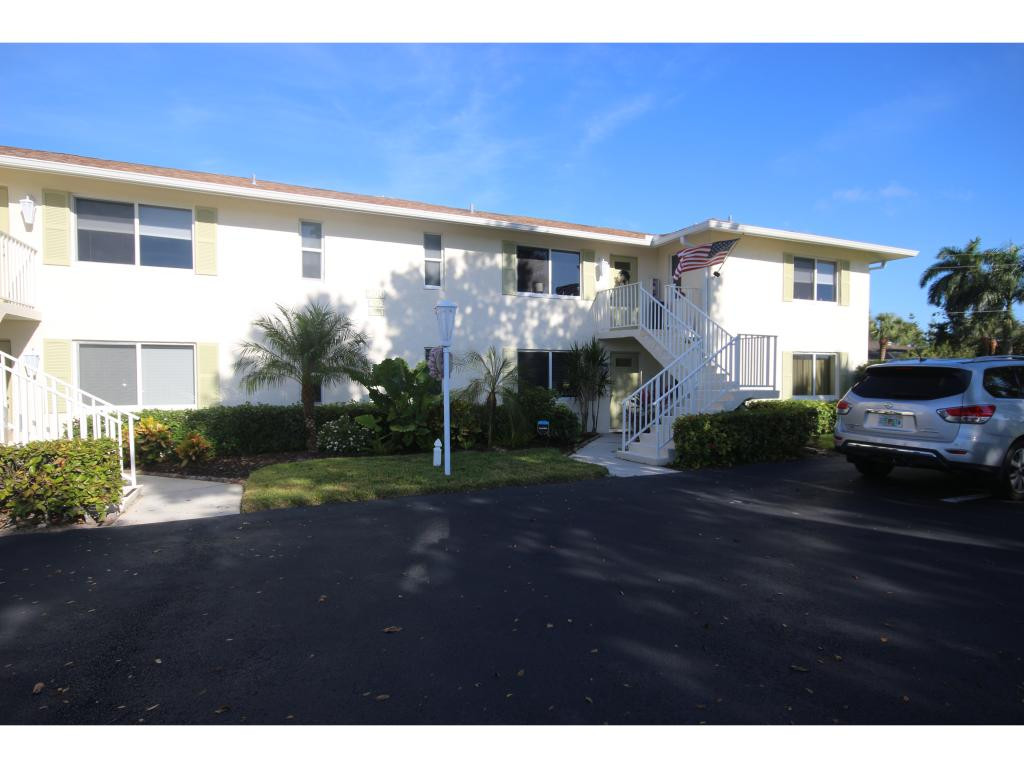 700 Teryl Road, Unit 1 Naples, FL 34112 - Photo 2 of 33 a front view of a house with a yard