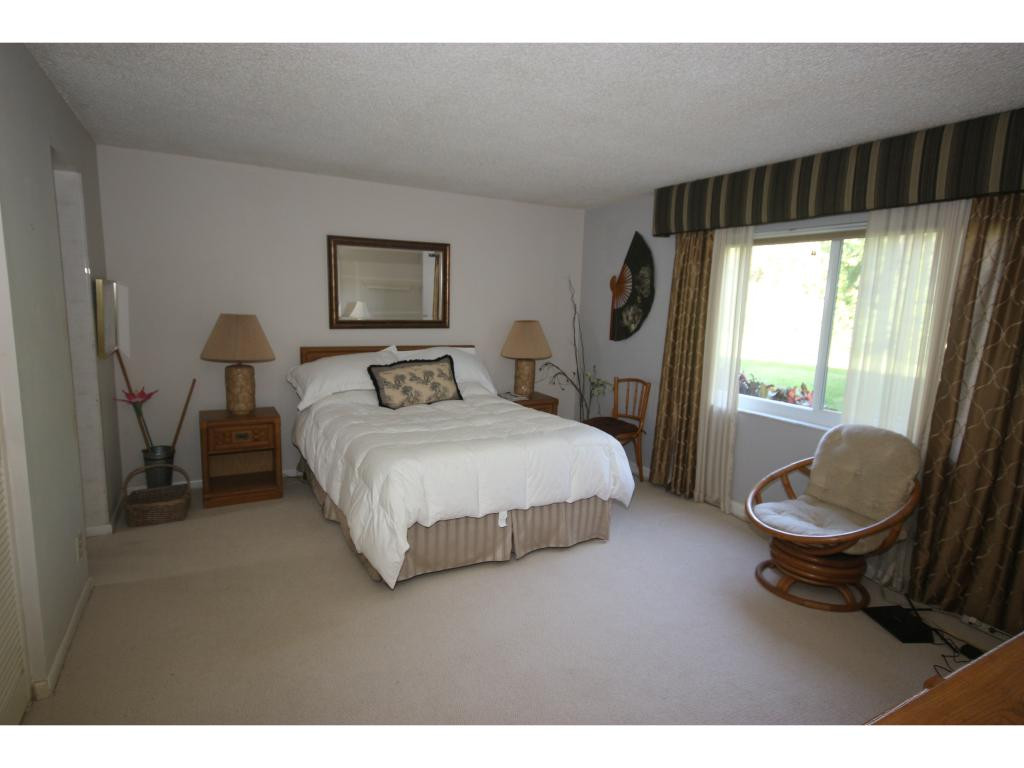 700 Teryl Road, Unit 1 Naples, FL 34112 - Photo 11 of 33 a bedroom with a bed and a window