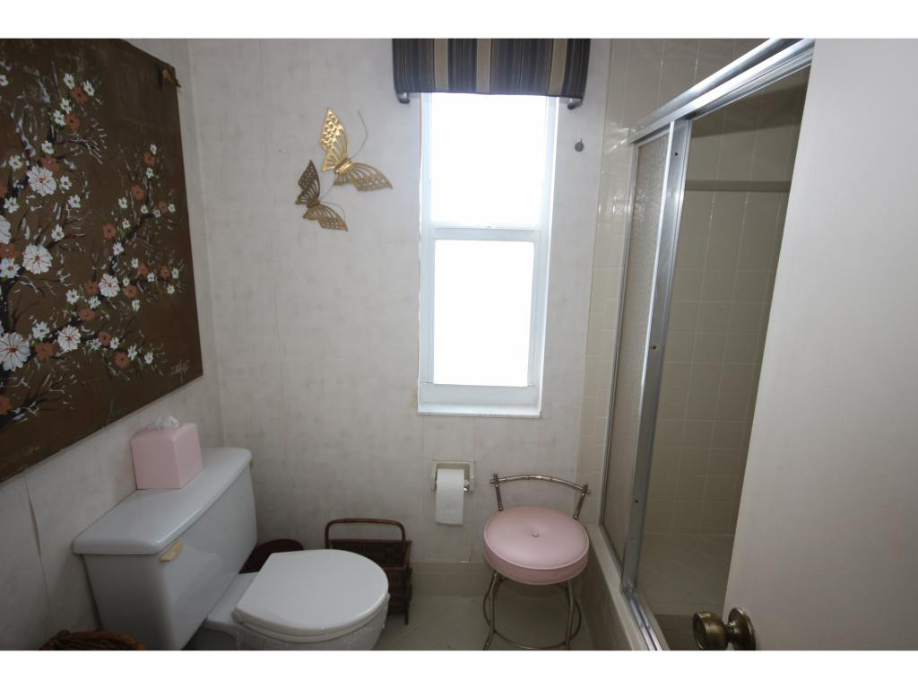 700 Teryl Road, Unit 1 Naples, FL 34112 - Photo 14 of 33 a bathroom with a toilet and a shower