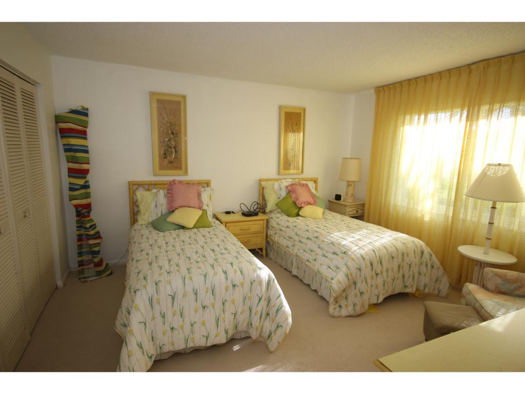 700 Teryl Road, Unit 1 Naples, FL 34112 - Photo 15 of 33 a bedroom with two beds and painting on the wall