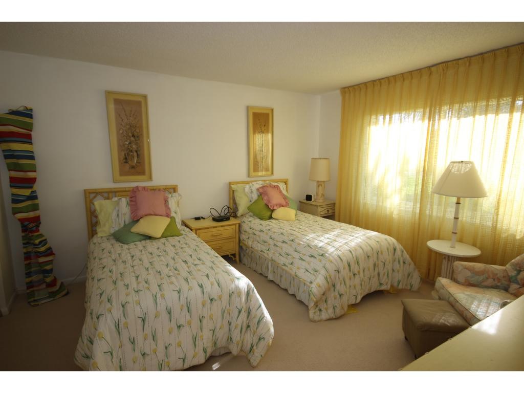 700 Teryl Road, Unit 1 Naples, FL 34112 - Photo 16 of 33 a bedroom with two beds and painting on the wall