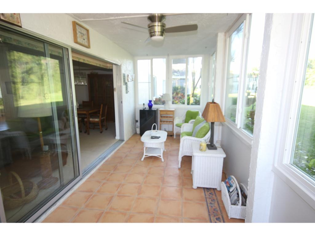 700 Teryl Road, Unit 1 Naples, FL 34112 - Photo 18 of 33 a living room with furniture and a large window
