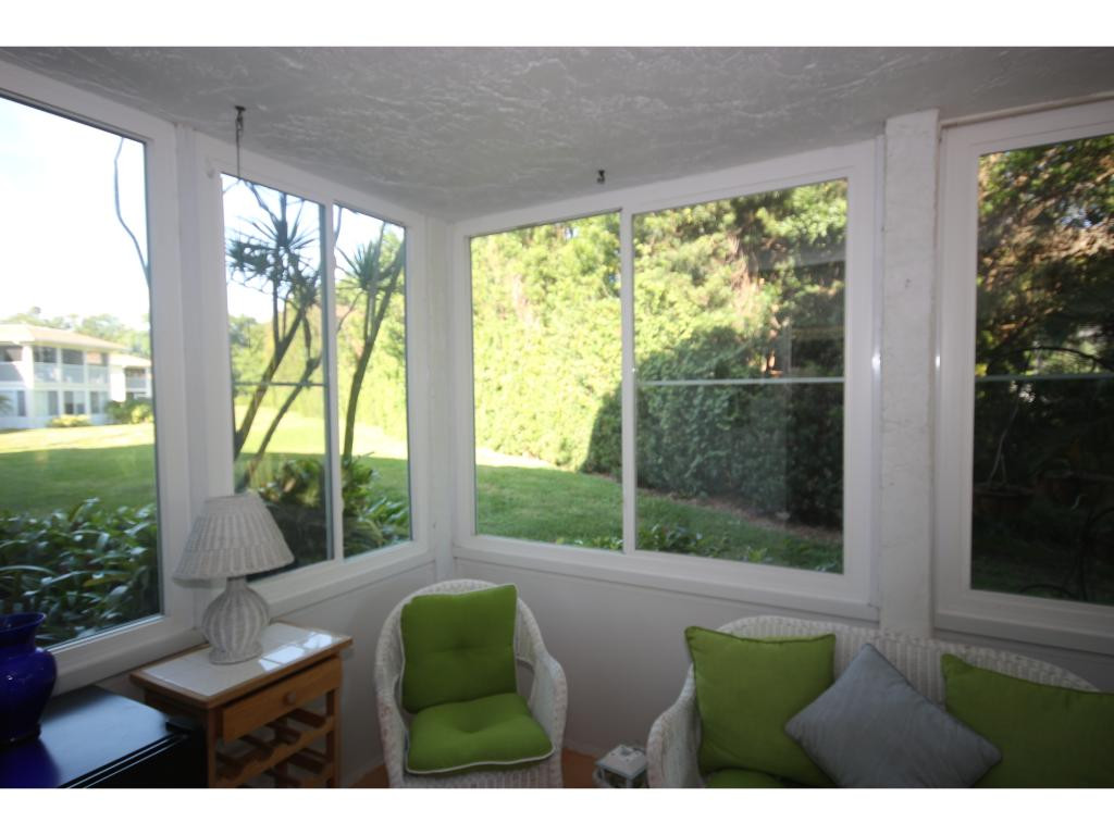 700 Teryl Road, Unit 1 Naples, FL 34112 - Photo 22 of 33 a outdoor living space with furniture and garden view