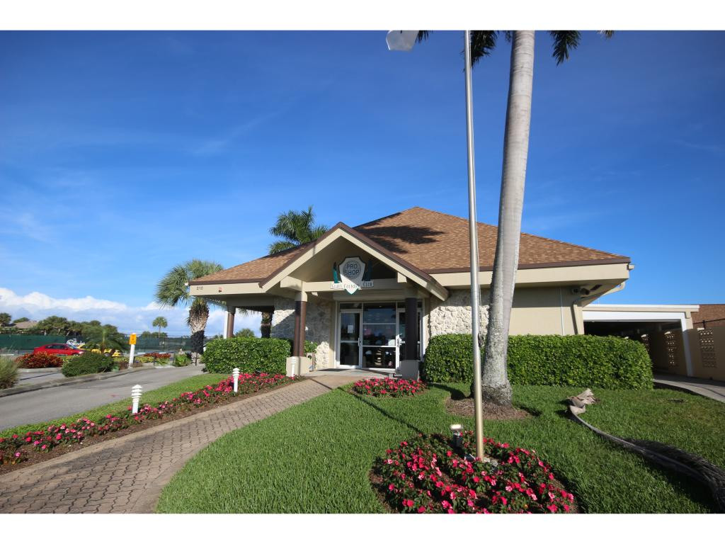 700 Teryl Road, Unit 1 Naples, FL 34112 - Photo 28 of 33 a view of a house with a big yard plants and large tree