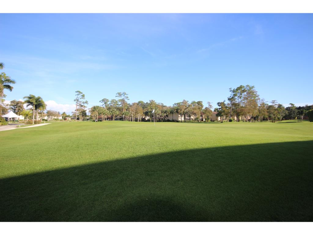 700 Teryl Road, Unit 1 Naples, FL 34112 - Photo 31 of 33 a view of a lake with a big yard