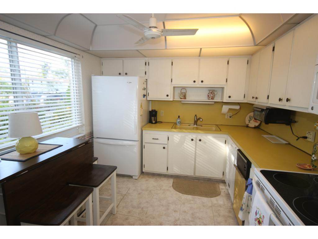 700 Teryl Road, Unit 1 Naples, FL 34112 - Photo 5 of 33 a view of a kitchen with a sink