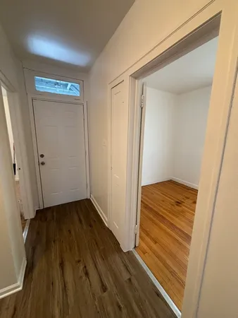a view of room with wooden floor