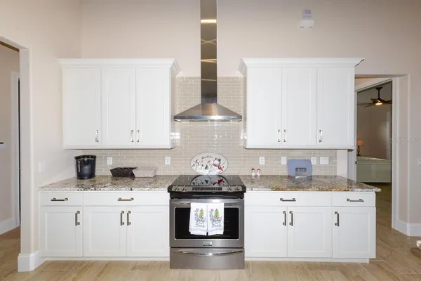 a kitchen with stainless steel appliances a refrigerator stove and sink