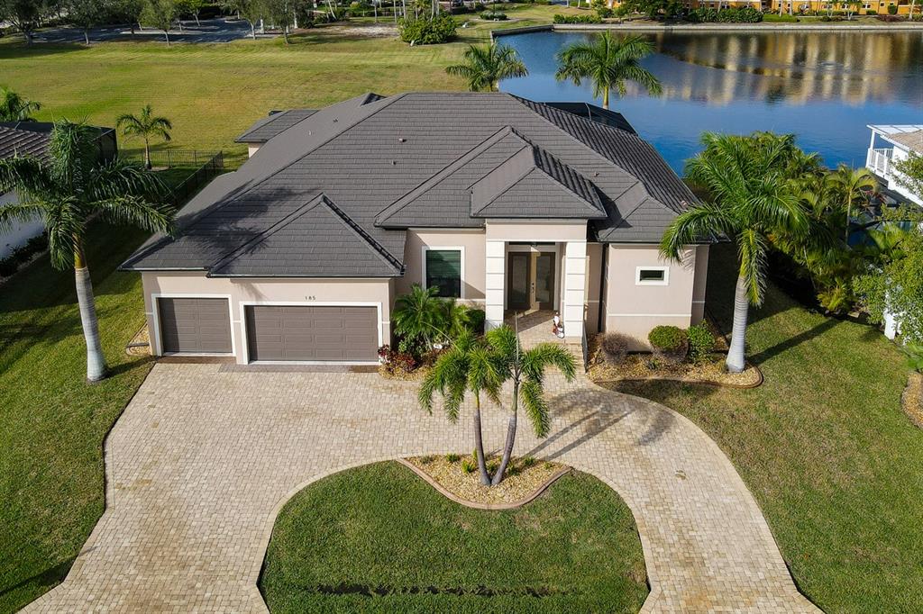 185 Colony Point Drive Punta Gorda, FL 33950 - Photo 2 of 54 a front view of a house with a yard