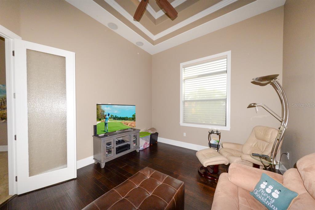 185 Colony Point Drive Punta Gorda, FL 33950 - Photo 21 of 54 a living room with furniture and a flat screen tv