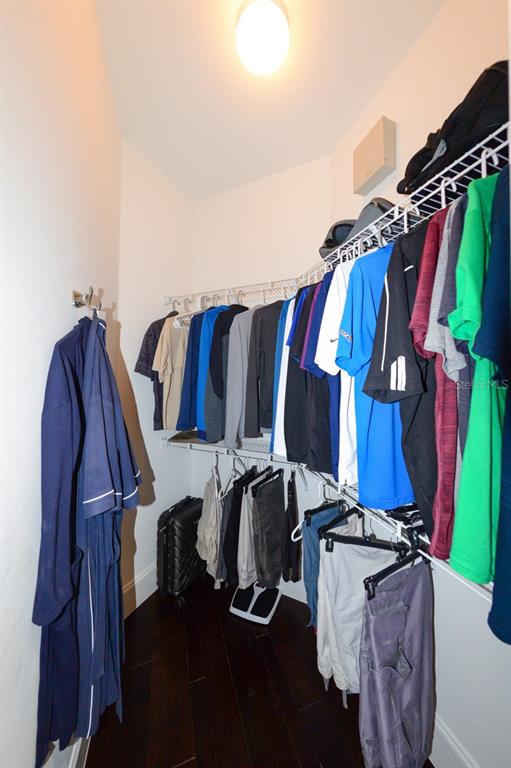 185 Colony Point Drive Punta Gorda, FL 33950 - Photo 26 of 54 a view of walk in closet with clothes and shoes